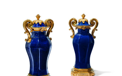 A PAIR OF MONUMENTAL LOUIS XVI ORMOLU-MOUNTED CHINESE BLUE PORCELAIN TWIN-HANDLED VASES