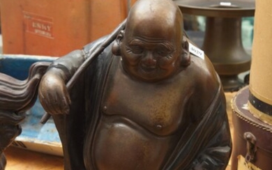 A PATINATED IRON BUDDHA FIGURE WITH STICK ACROSS SHOULDER, H.44CM, LEONARD JOEL LOCAL DELIVERY SIZE: SMALL