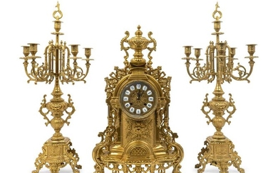 A Regence Style Gilt-Metal Three-Piece Clock Garniture