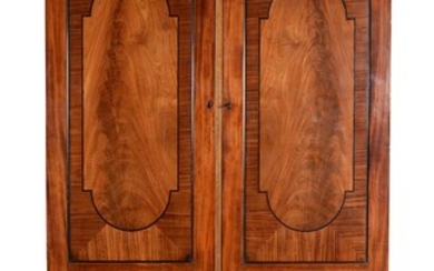 A Regency mahogany and ebonised inlaid wardrobe