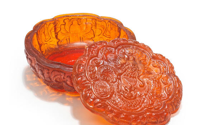 A VERY RARE CARVED AMBER MELON-SHAPED 'DRAGON' BOX AND COVER