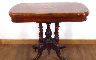 A Victorian figured walnut and marquetry games table on four...