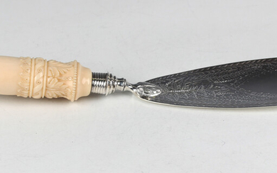 A Victorian silver and ivory handled fish slice, the blade engraved with fern fronds, the ivory hand