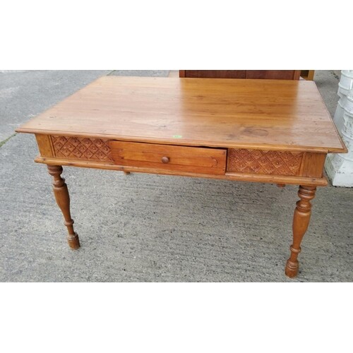 A Victorian style stripped pine kitchen table with tapered l...