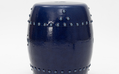 A barrel shaped Chinese blue glazed garden seat, 20th century.