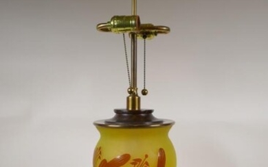 A continental yellow and amber cameo glass lamp in...