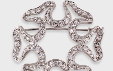 A diamond and platinum brooch designed as millegrained platinum...