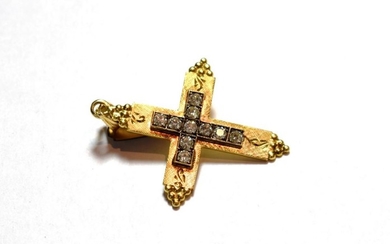 A diamond cross pendant, the cross motif set throughout with...