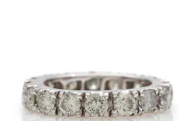 A diamond eternity ring set with numerous brilliant-cut diamonds totalling app. 3.38...