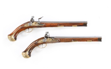 A fine pair of Austrian flintlock holster pistols marked 'Johann Zeffel in Wienn'. Walnut stocks with engraved brass furniture. Brass lockplate with facets. The hand inlayed with a monogram FV in shield. The pommels engraved and with a cap. The coun