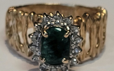 A green tourmaline and diamond ring in 14k yellow gold