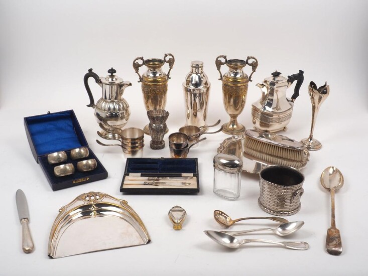 A group of silver plated items including eight silver plated brandy warmers, two by Christofle; a cocktail shaker; a cased set of mother of pearl handled knives; a white metal filigree vase; a set of four napkin rings (unmarked), a wine coaster; a...