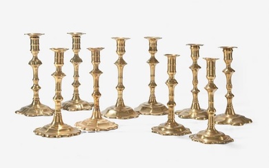 A group of ten George II scallop or petal-base brass candlesticks, England, 18th century