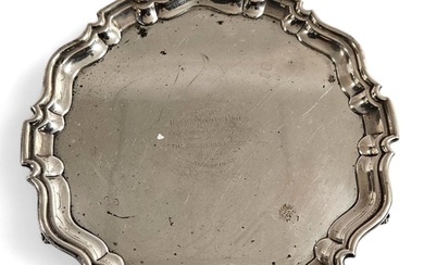 A hallmarked silver circular salver with central presentatio...