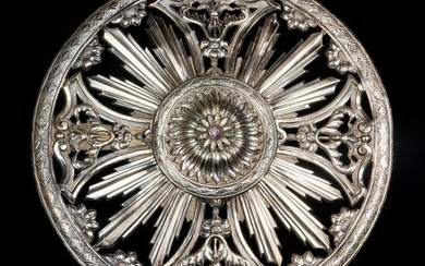 A jeweled and repousse silvered sunburst wall ceiling