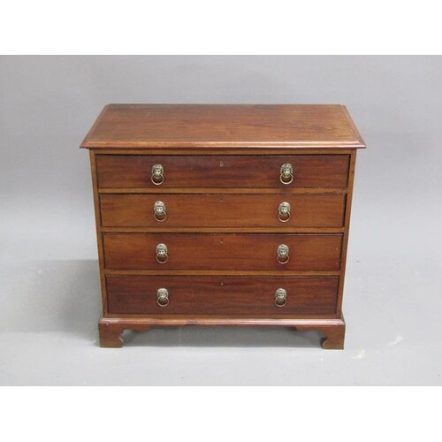 A late Georgian mahogany small chest of four long graduated ...