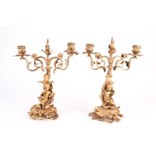 A pair of 19th century French gilt bronze garniture candelab...