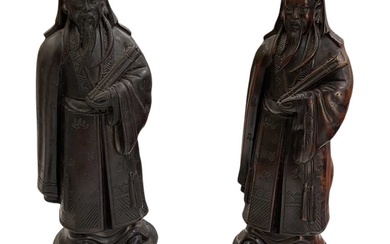 A pair of Chinese carved hardwood figures of a gentleman,...