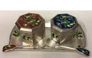 A pair of Continental silver and enamelled boxes on matching...