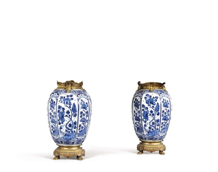 A pair of Delft earthenware and gilt-bronze mounted vases