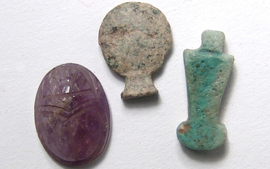 A pair of Egyptian amulets and a scarab