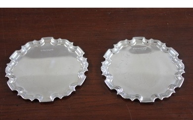 A pair of Elizabeth II silver waiters with pie-crust edges, ...