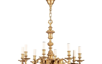 A pair of Louis XIV style gilt-bronze eight-light chandeliers, early 20th century | Paire de lustres en bronze doré de style Louis XVI, début du XXe siècle