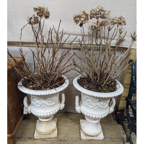 A pair of Victorian style white painted cast metal campana g...