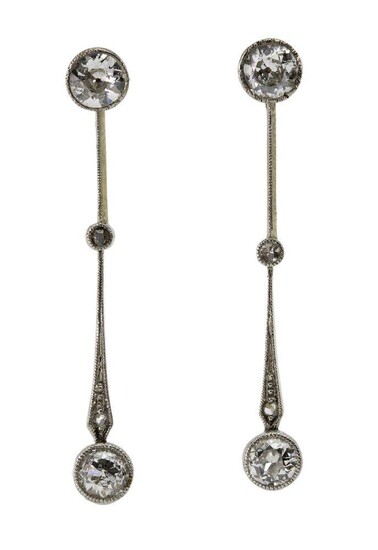 A pair of diamond drop earrings, each composed of three circular-cut diamonds connected by millegrain knife edge bars with single rose-cut diamond points, post fittings, c.1900