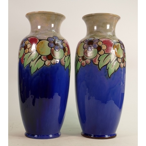 A pair of large Royal Doulton Lambeth vases: Decorated all a...