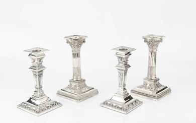 A pair of late Victorian silver candlesticks, of Corinthian form,...