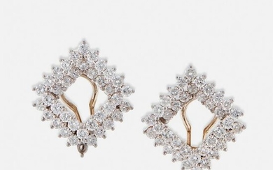 A pair of platinum and diamond earclips, Angela