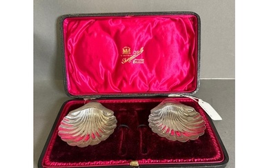 A pair of silver scalloped dishes by Atkins brother, hallmar...