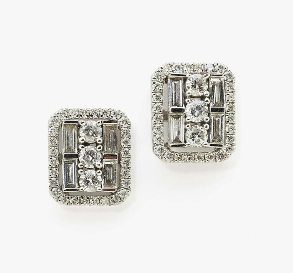 A pair of stud earrings with brilliant cut diamonds and