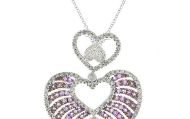 A pink sapphire and diamond heart pendant, suspended from a chain.