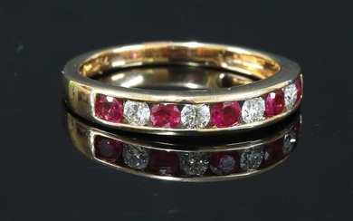 A rose gold ruby and diamond half eternity ring