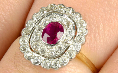 A ruby and circular-cut diamond cluster ring.