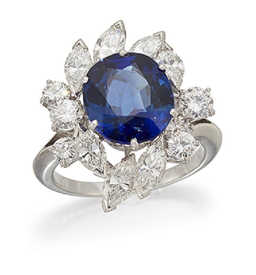 A sapphire and diamond cluster ring, the...