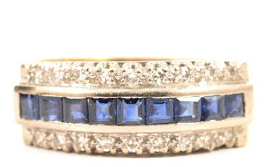 A sapphire and diamond half hoop ring.
