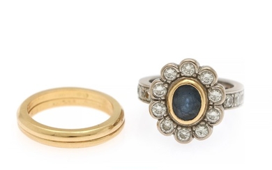 A sapphire and diamond ring set with an oval-cut sapphire encircled by numerous brilliant-cut diamonds, mounted in 18k gold and white gold. (3)