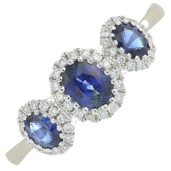 A sapphire and diamond ring.Total sapphire weight