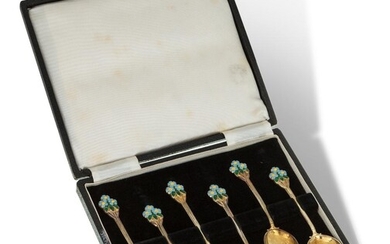 A set of enamelled silver gilt coffee spoons, Birmingham, 1952, Turner & Simpson, the six spoons designed with blue and yellow flower terminals, in fitted case, 9cm long, approx. weight 1.8oz