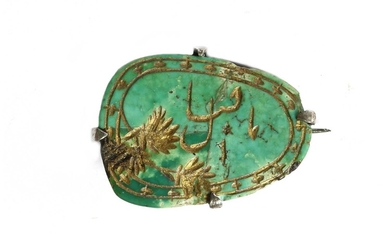 A silver turquoise brooch
