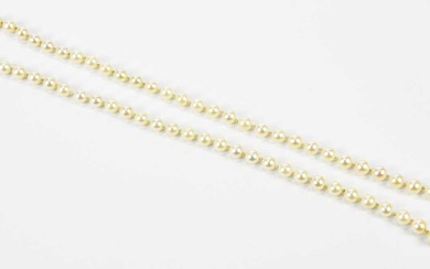 A single strand of pearls with 9ct white gold clasp,...