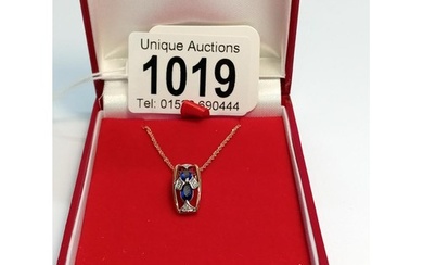 A superb quality 9ct gold diamond and sapphire pendant with ...