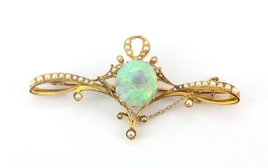 A yellow metal (tested high carat gold) brooch set with a cabochon cut opal and seed pearls, approx. 6.3ct opal L. 7cm.