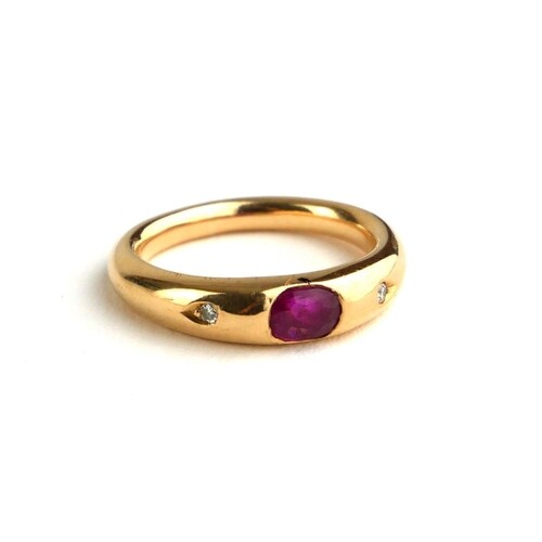 AN 18CT GOLD, RUBY AND DIAMOND RING The single oval cut ruby...