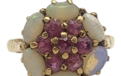 AN EARLY 20TH CENTURY 9CT GOLD RUBY AND OPAL RING The cluste...