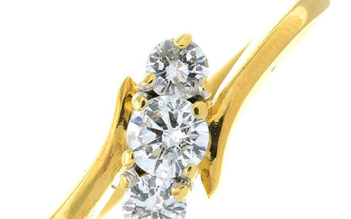 An 18ct gold brilliant-cut diamond three-stone crossover ring.