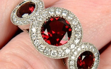 An 18ct gold garnet and brilliant-cut diamond triple cluster ring.Largest garnet calculated weight
